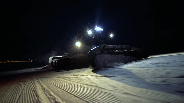 Snowcat Works At The Ski Slopes