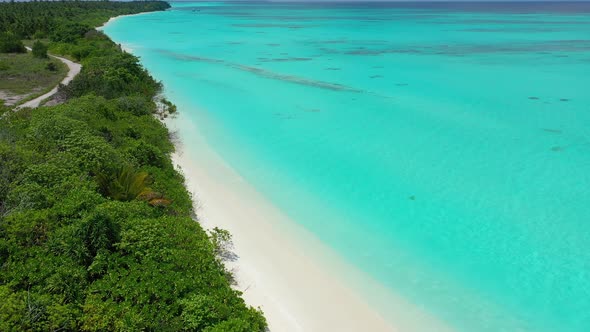 Natural aerial clean view of a sunshine white sandy paradise beach and turquoise sea background in h