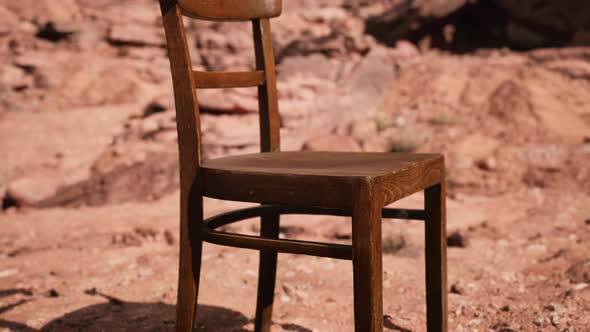 Old Wooden Chair on Rocks of Grand Canyon