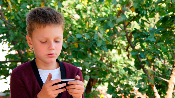 Young Man Communicates On The Smartphone