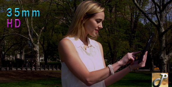 Woman In Central Park With Tablet