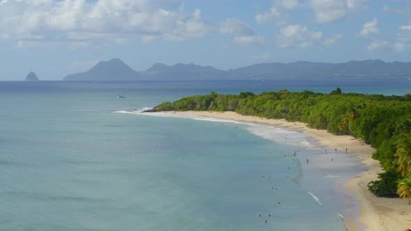 Aerial of tourist on beautiful sea coast at Grande-Anse, les Saintes