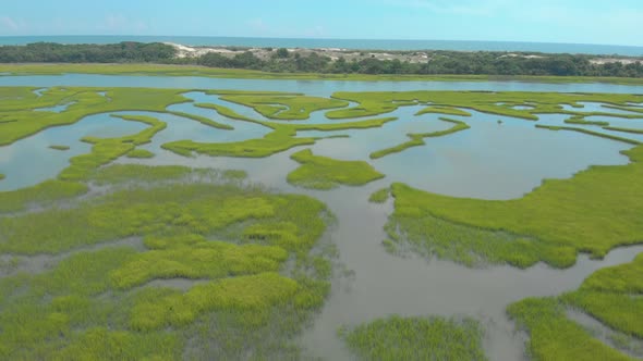 drone shots of the sand dunes and marsh lands at the coast