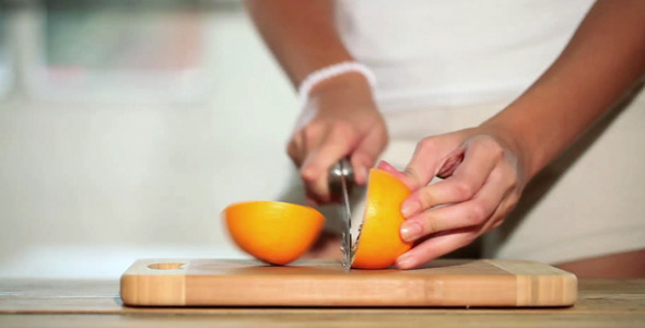 Girl Cutting Orange