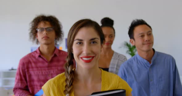 Happy multi-ethnic business colleagues walking together in modern office 4k