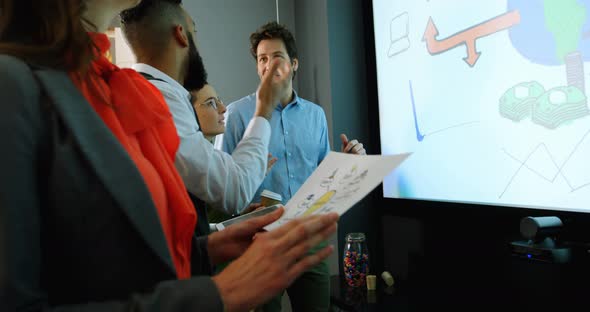 Executives interacting with each other in conference room 4k