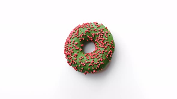 Top View Fresh Appetizing Ring Doughnut Covered By Bright Green Frosting