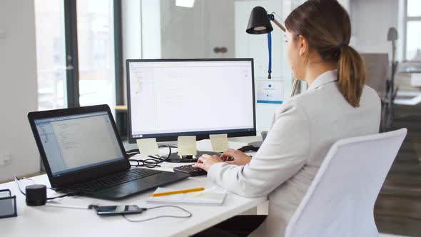 Female Programmer with Computer Working at Office 18