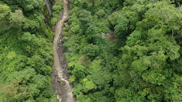 Flying Over the Mountain River in Tropical Forest