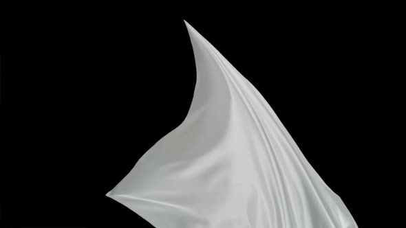 White fabric flowing on black background, Slow Motion