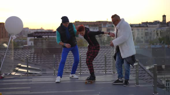 Wide Shot Joyful Woman Standing on Skateboard with Men Holding Hands Helping