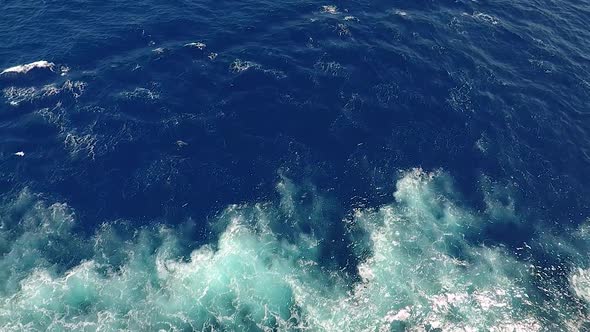 Top View of the Waves, Foaming and Splashing in the Ocean, Sunny Day.