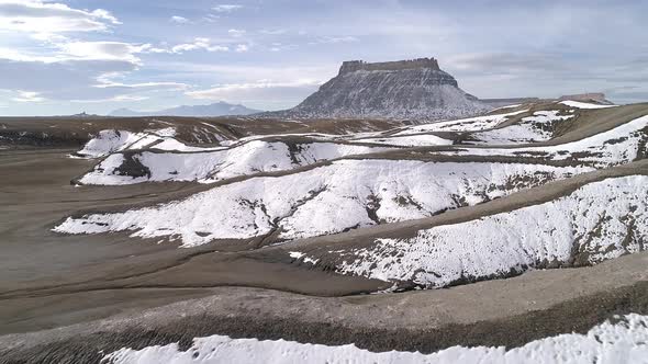 Flying low over snow covered desert dunes in Utah