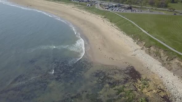 Aerial birds eye view drone view of Seaburn Beach, Sunderland, North East England, UK on a summer da