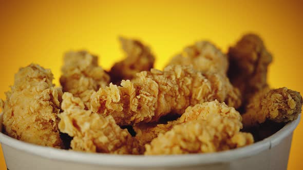 Big Bucket of Crispy Golden Chicken Wings Legs and Strips