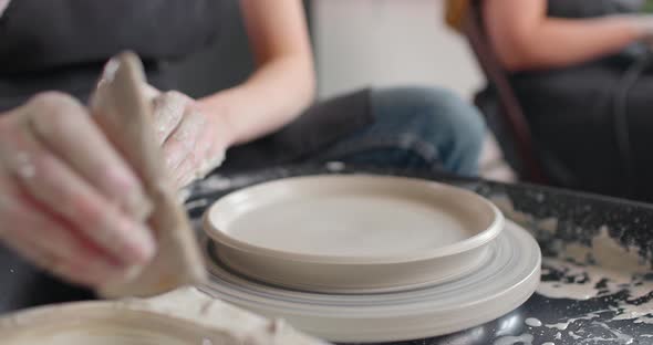 Hands of Young Woman in Pottery Studio Using Pottery Wheel Handmade Ceramics Creative