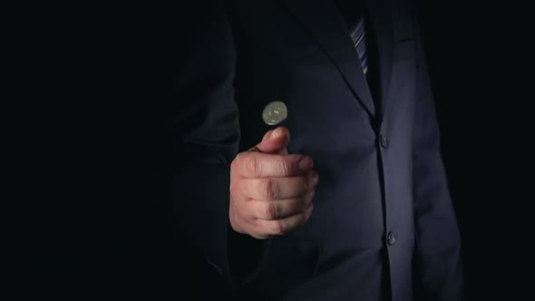 Businessman Throws Up And Catches A Coin