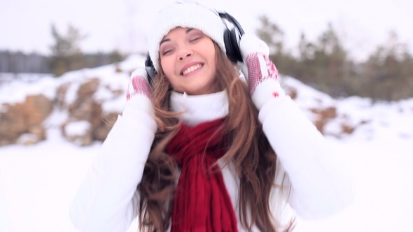 Winter Girl Dancing with Headphones