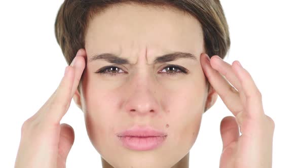 Close Up of Woman Face Gesturing Headache Stress