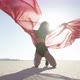 Girl with a fabric dancing in the desert - VideoHive Item for Sale