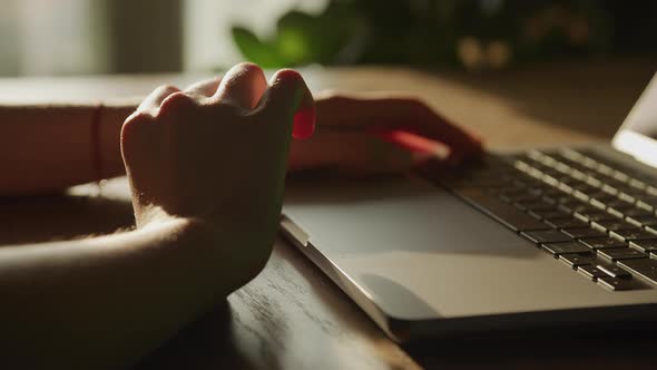 Close Up of Caucasian Woman Hands Hold in Doubt Thinking in Front of a Laptop Computer Touchpad