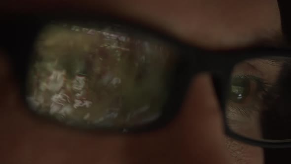 Close Up Footage of Reflection of Computer Game in Glasses of Caucasian Male in Slowmotion