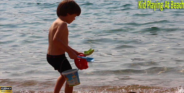 Kid Playing At Beach