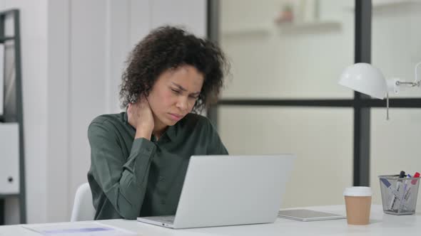 African Woman Having Neck Pain While Using Laptop