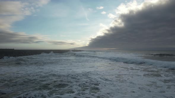 Flying Over Huge Waves at Evening Day