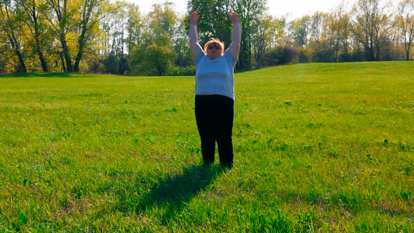 Sport - Overweight Woman Exercising On Meadow