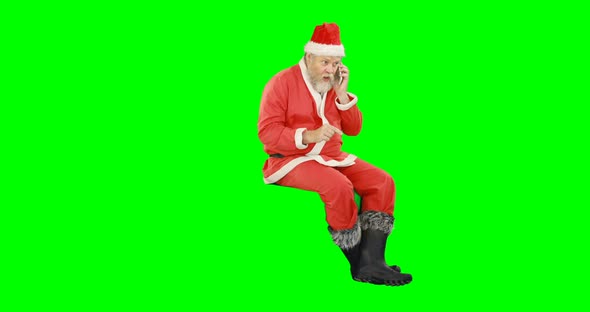 Santa claus talking on mobile phone 4k