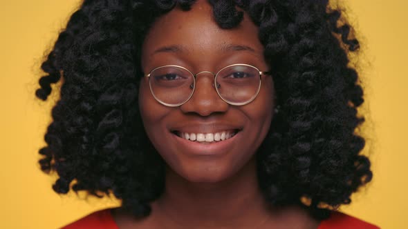 Close Up of African Woman Smiling Sincerely at Studio