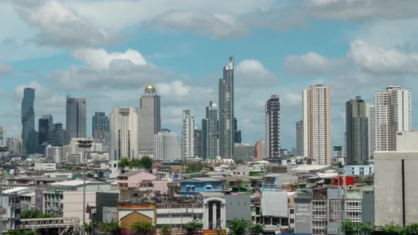 Bangkok Skyline Timelapse Blue skies with clouds over City Skyscrapers Zoom out