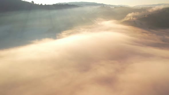 4K Drone Flying in the clouds. Flying through the clouds during sunrise