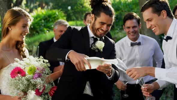 Groom serving champagne to the guests 4K 4k