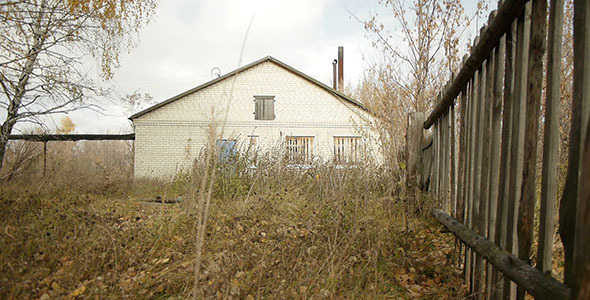 Wooden Fence And Abandoned Village Building