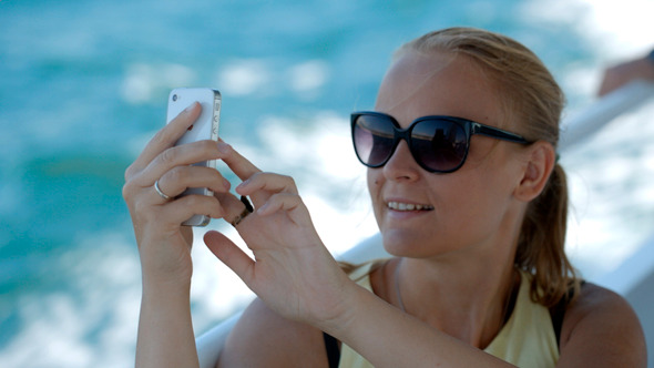 Woman Making Selfie With Smatphone On The Boat
