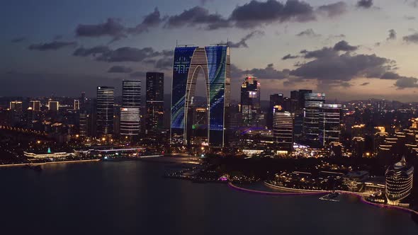 CBD buildings by Jinji Lake at night in Suzhou