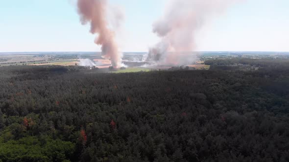 Aerial View of Fire in Wheat Field. Flying Over Smoke Above Agricultural Fields