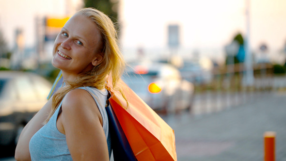 Smiling Woman With Shopping Bags Outdoor