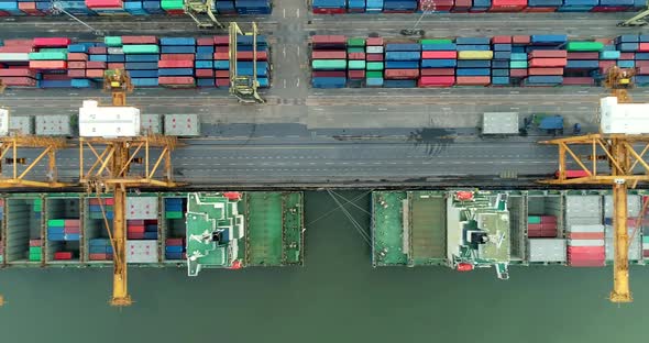 Aerial view 4k video by drone of container ships and lifting cranes in the Port