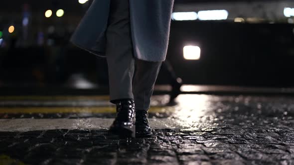 Woman is Walking in City in Evening Details Shot of Legs in Dark Street Autumn and Rainy Weather