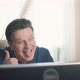 Joyful Man Showing Tongue While Sitting at Computer - VideoHive Item for Sale