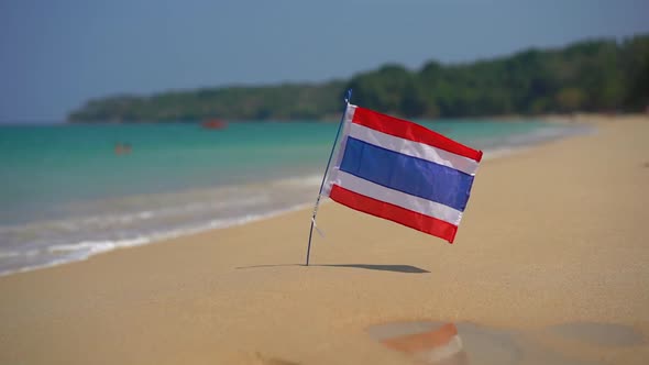 Superslowmotion Shot of a National Flag of Thailand on a Beautiful Beach. Tropical Vacation Concept