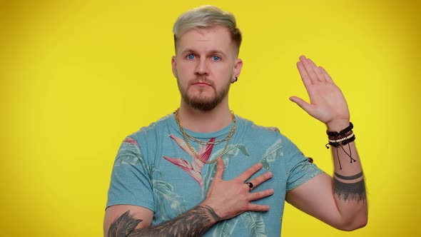 Sincere Responsible Tourist Man Raising Hand to Take Oath Promising to Be Honest and to Tell Truth