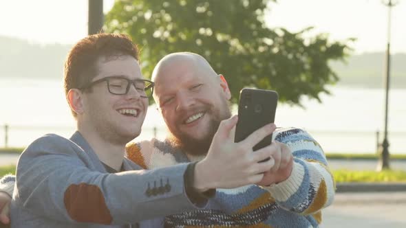 Men Taking Selfie on Smartphone Dating at Sunrise. Cute Male Homosexual Gay Couple Spend Time