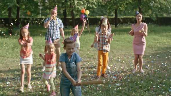 Boy Striking Pinata