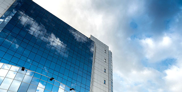 Sky With Clouds Reflected In A Modern Office Glass