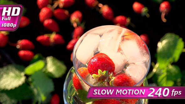 Ice Cubes Falling into Berry Drink  