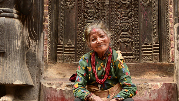 Old Woman On Steps Of Temple